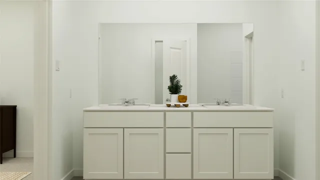 a bathroom with a sink and vanity