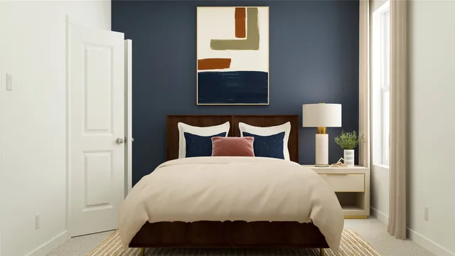 a bedroom with a bed and window