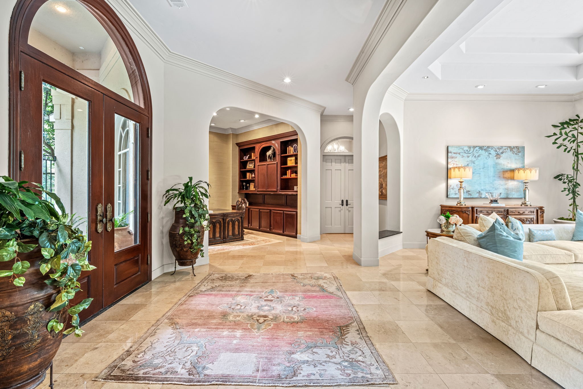 6 Mott Lane Houston, TX 77024 - Photo 12 of 50 Entry w Jura Stone Limestone flooring. Study with built-ins overlooking lush landscaped front yard.
