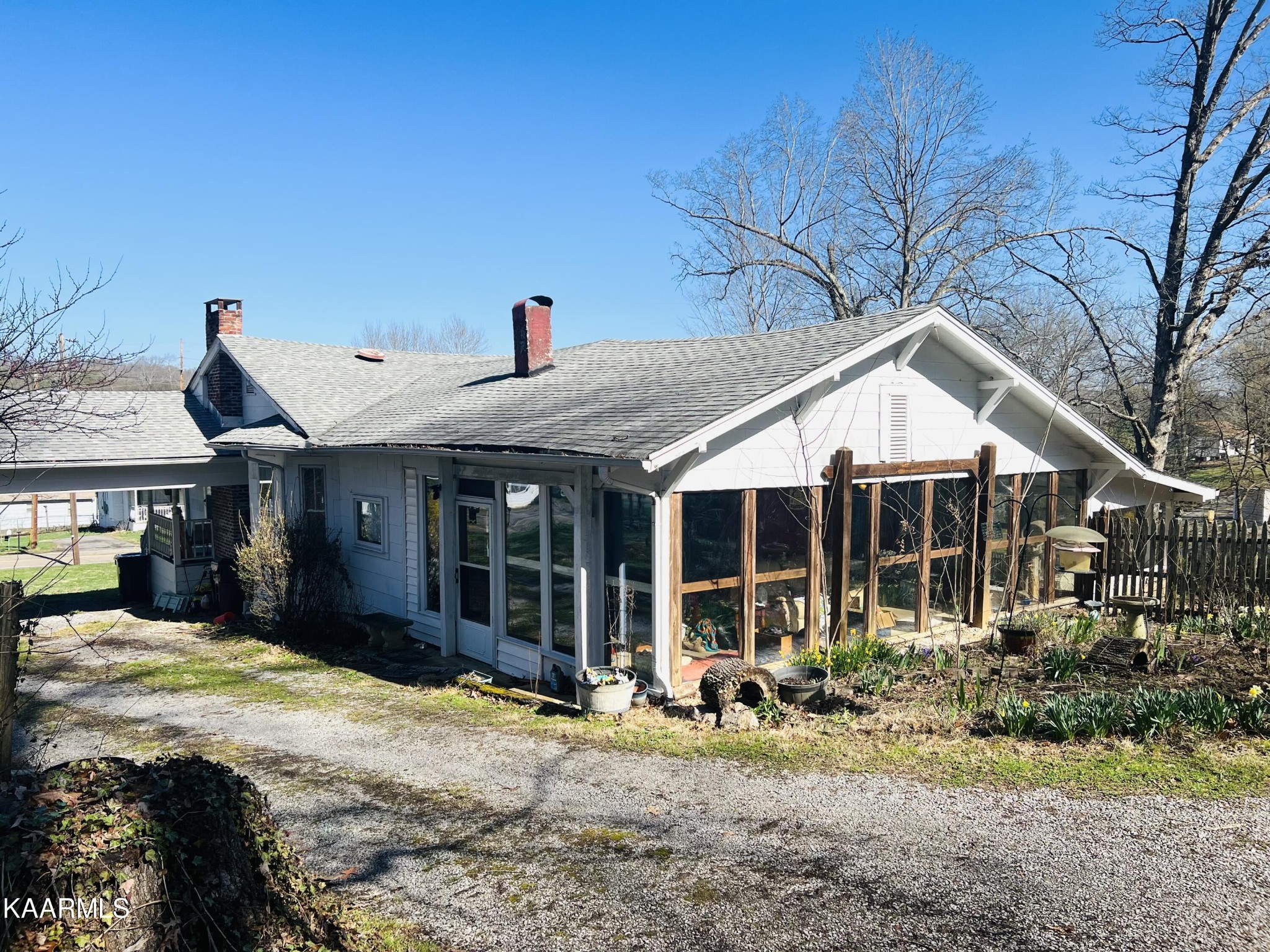 2108 Maple Drive Knoxville, TN 37918 - Photo 9 of 9 a view of a house with a yard covered in the forest