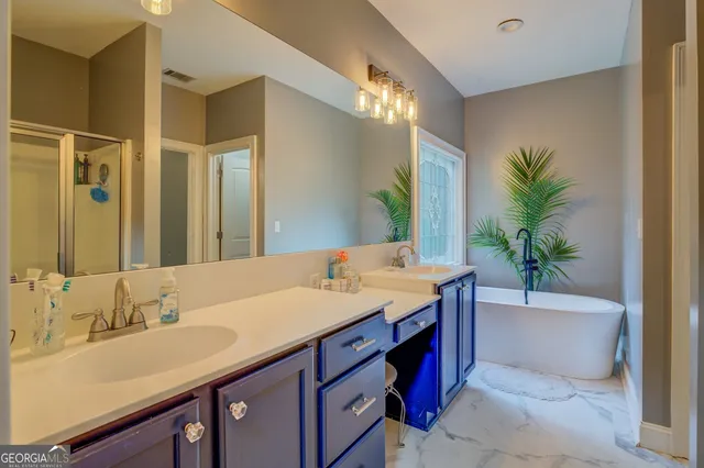 a white bath tub sitting in a bathroom