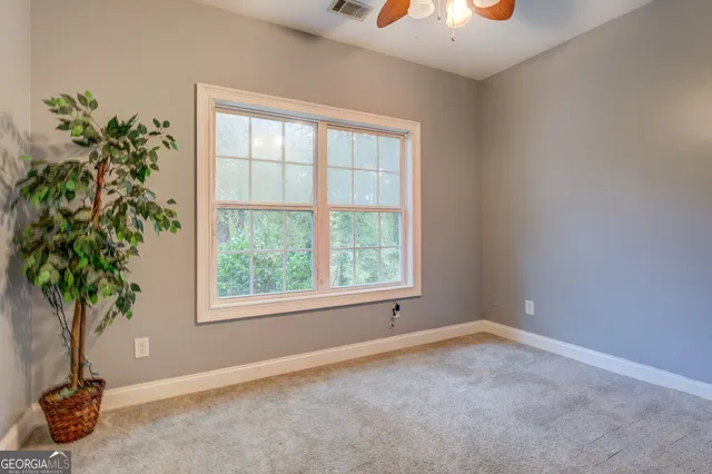 a view of a house with a porch and furniture