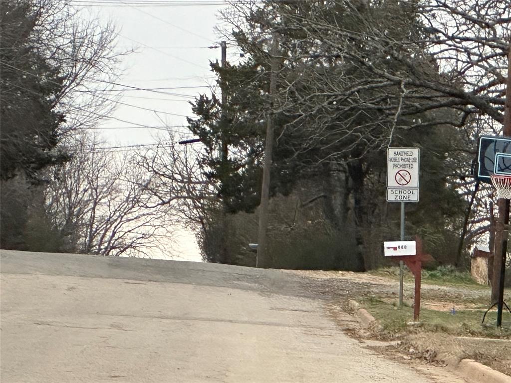 629 Munson Street Denison, TX 75021 - Photo 13 of 13 a sign board with yard