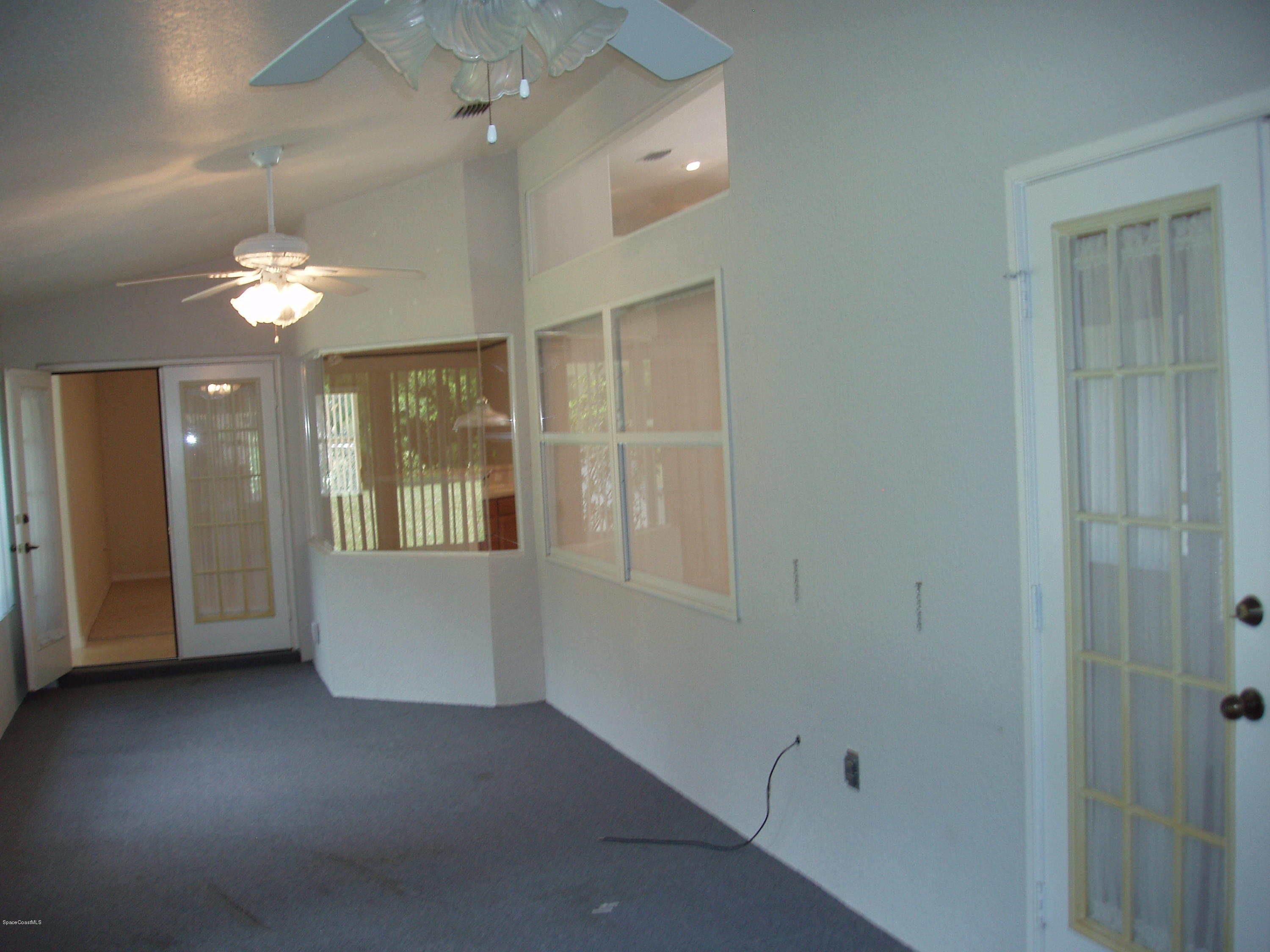 740 Riviera Drive Northeast Palm Bay, FL 32905 - Photo 22 of 30 Florida Room Access from House