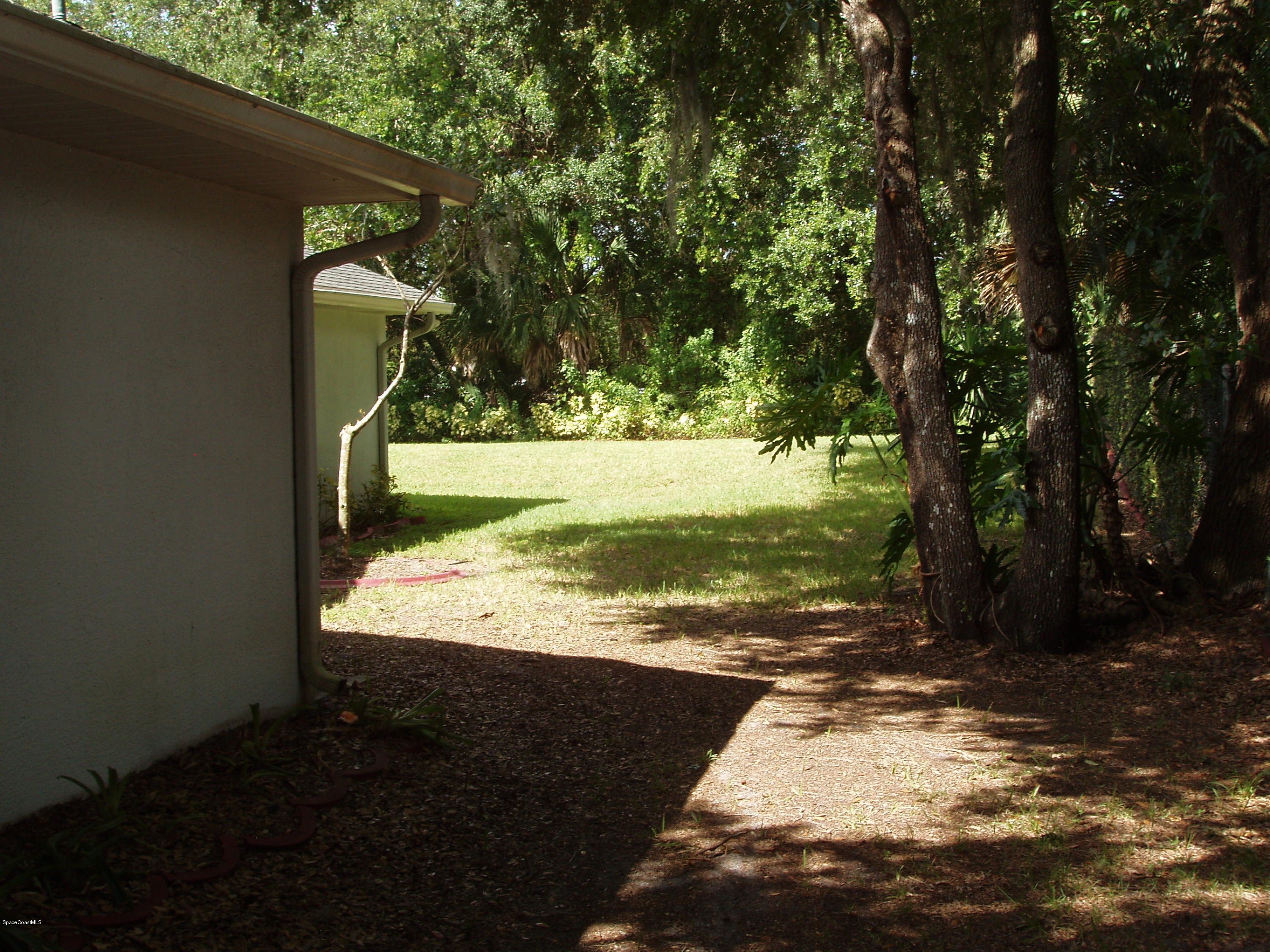 740 Riviera Drive Northeast Palm Bay, FL 32905 - Photo 23 of 30 North Side to Backyard