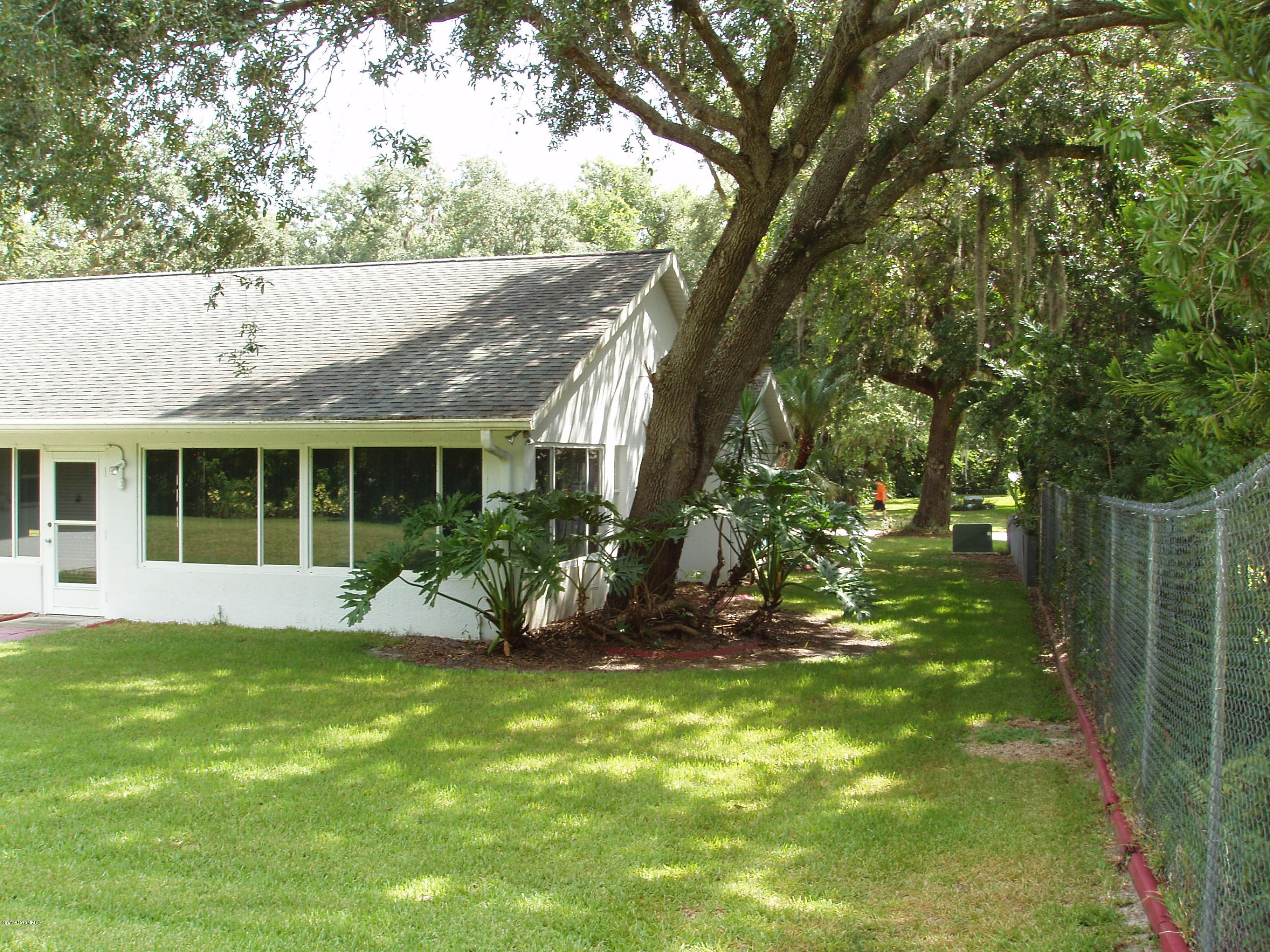 740 Riviera Drive Northeast Palm Bay, FL 32905 - Photo 24 of 30 South Side to Front Yard