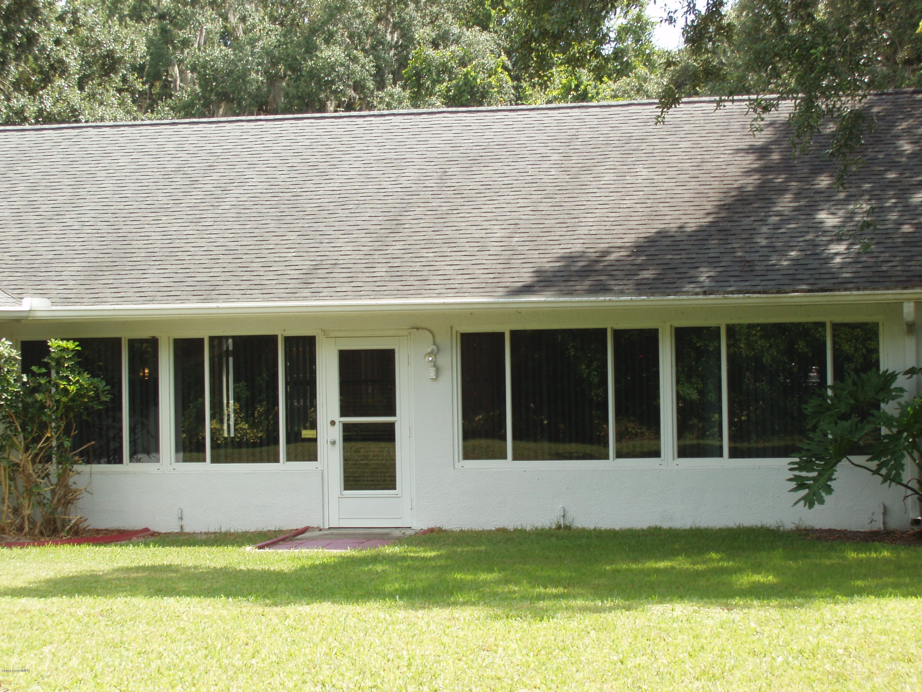 740 Riviera Drive Northeast Palm Bay, FL 32905 - Photo 27 of 30 Enclosed Trussed Porch