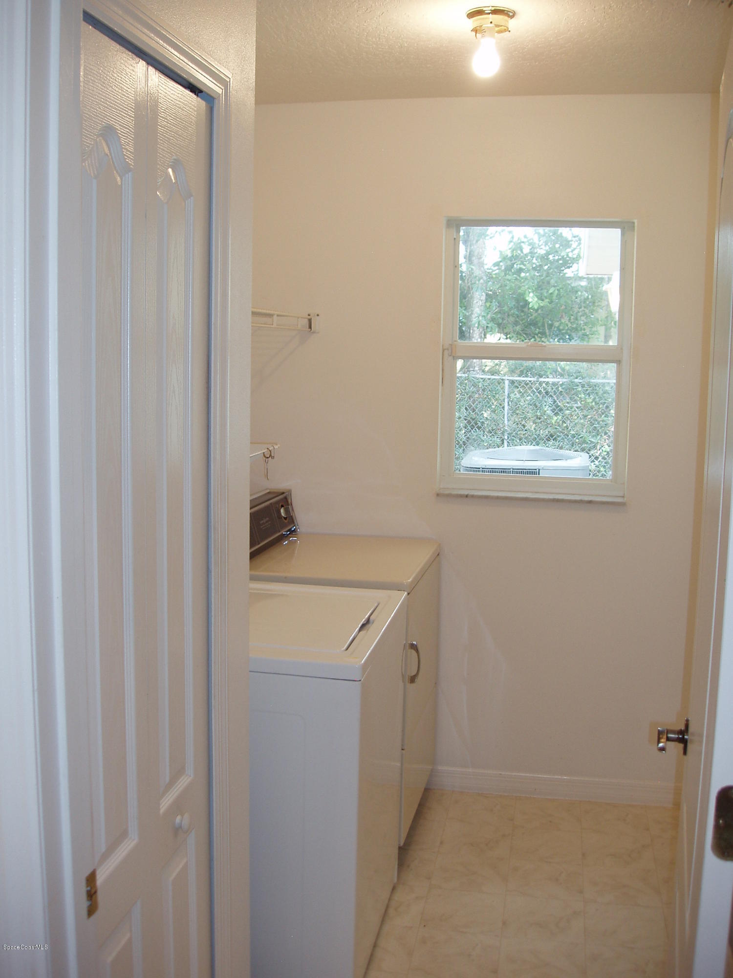 740 Riviera Drive Northeast Palm Bay, FL 32905 - Photo 5 of 30 Laundry Room & Pantry