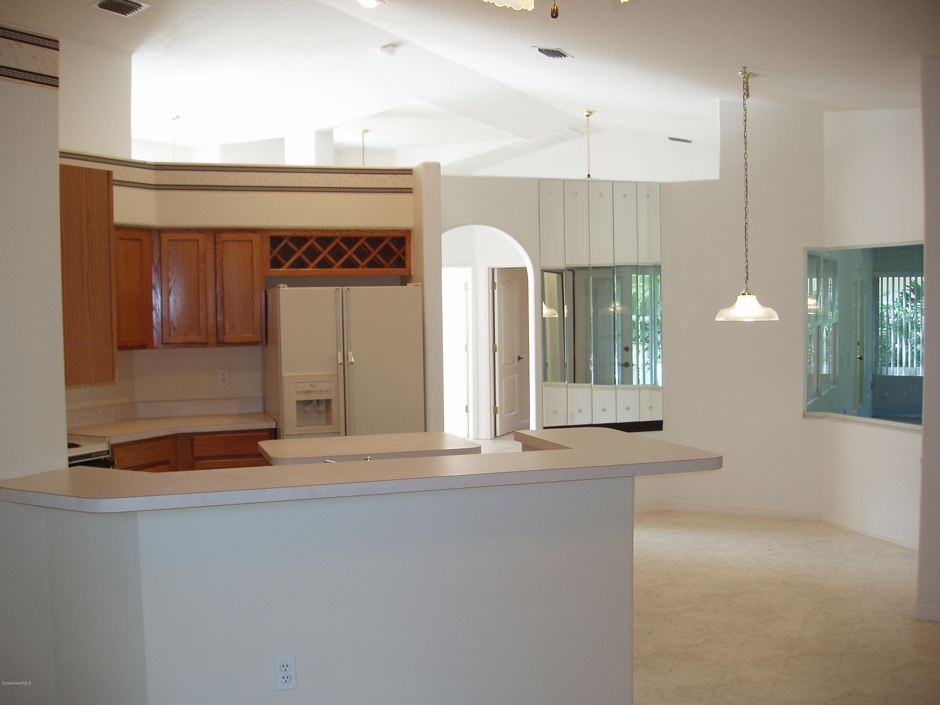 740 Riviera Drive Northeast Palm Bay, FL 32905 - Photo 9 of 30 Kitchen & Nook to Living & Dining
