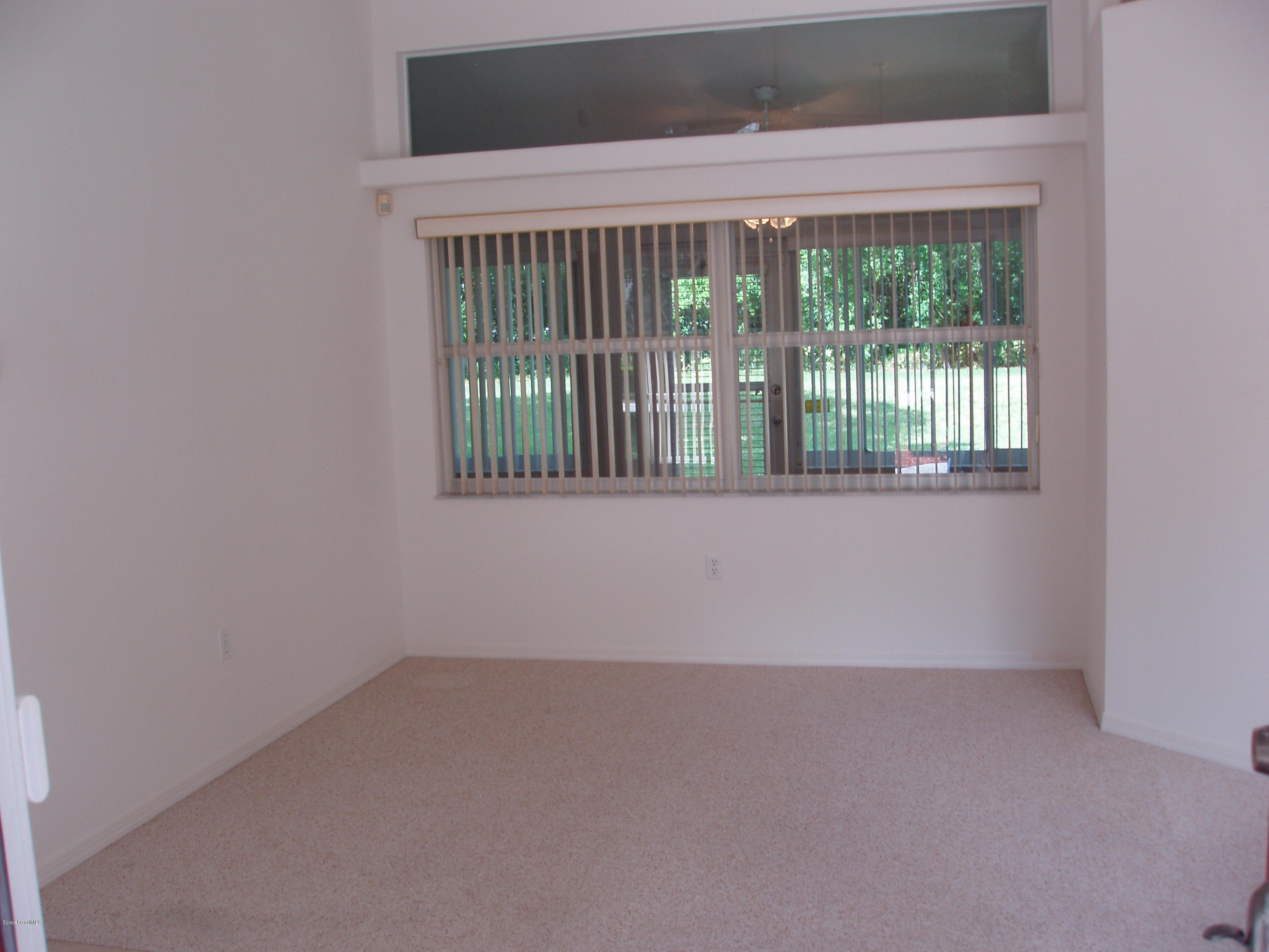 740 Riviera Drive Northeast Palm Bay, FL 32905 - Photo 10 of 30 Living Room to Enclosed Porch