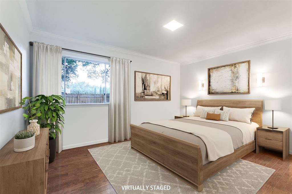 2718 Runningbrook Lane Dallas, TX 75228 - Photo 17 of 28 a bedroom with a large bed and a potted plant