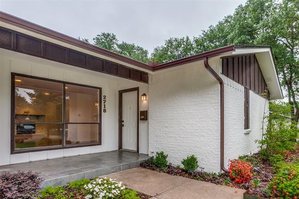 2718 Runningbrook Lane Dallas, TX 75228 - Photo 2 of 28 a front view of a house with a yard