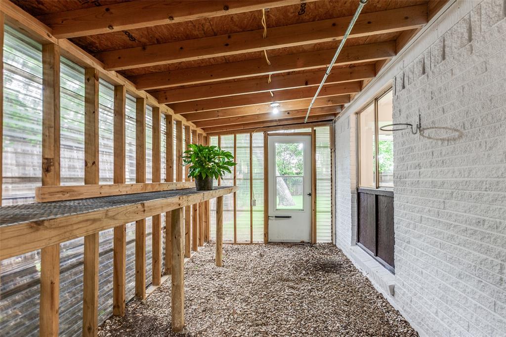 2718 Runningbrook Lane Dallas, TX 75228 - Photo 22 of 28 a view of an empty room with wooden floor and windows