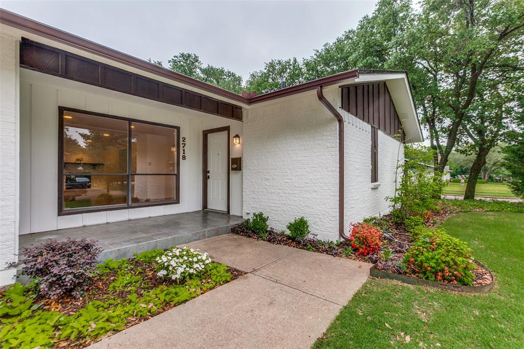 2718 Runningbrook Lane Dallas, TX 75228 - Photo 28 of 28 a front view of a house with garden