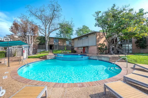 a view of a swimming pool with a patio