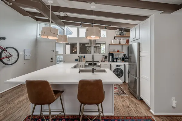 a kitchen with a table and chairs