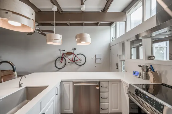 a kitchen with a sink and cabinets
