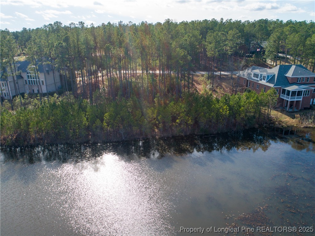82 Broadlake Lane Spring Lake, NC 28390 - Photo 2 of 7 a view of a lake with a mountain in the background