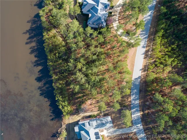a aerial view of a house with a yard