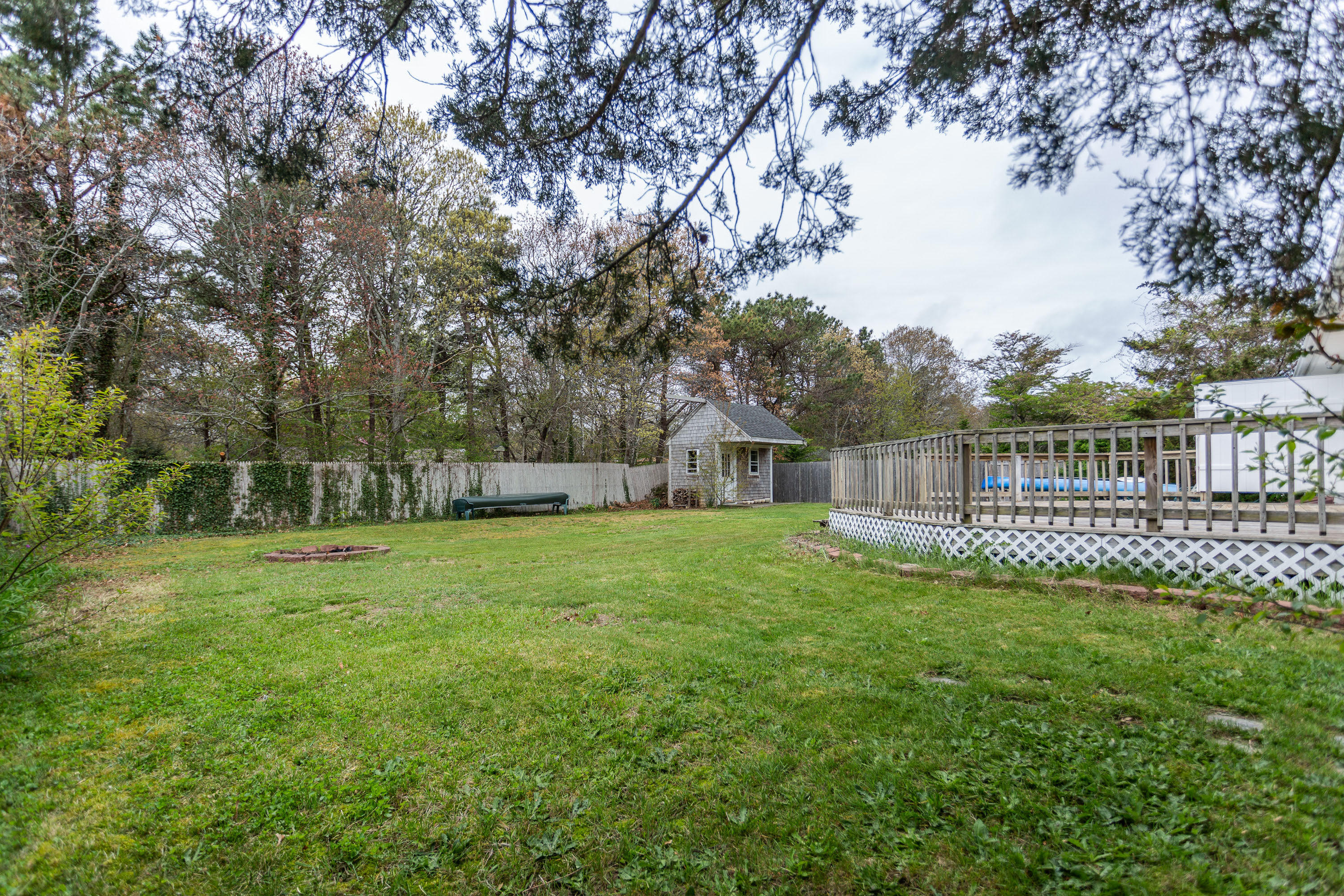 361 Megan Road Hyannis, MA 02601 - Photo 15 of 18 a view of a garden with a house in the background
