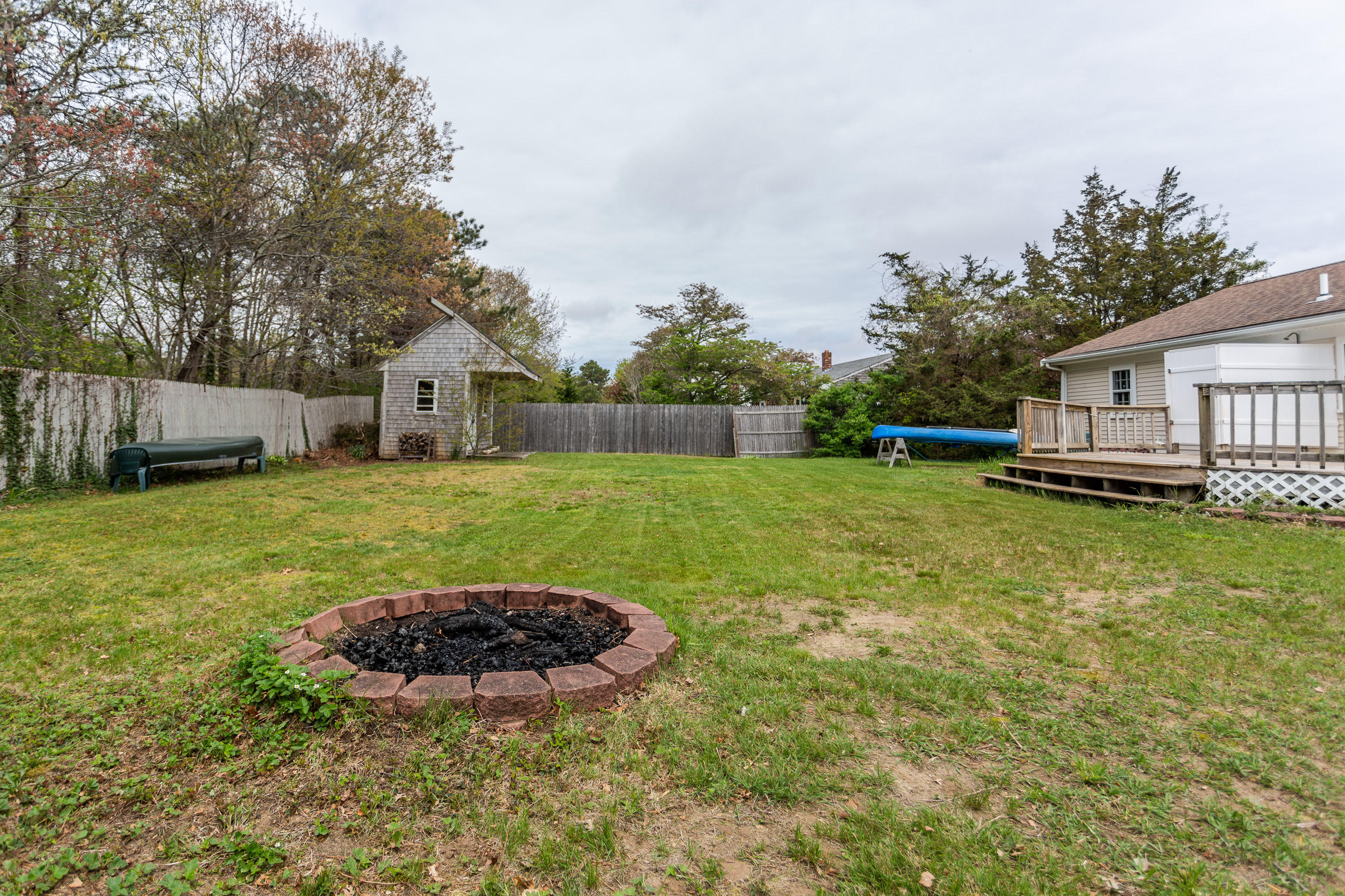 361 Megan Road Hyannis, MA 02601 - Photo 16 of 18 a view of a backyard with a small cabin