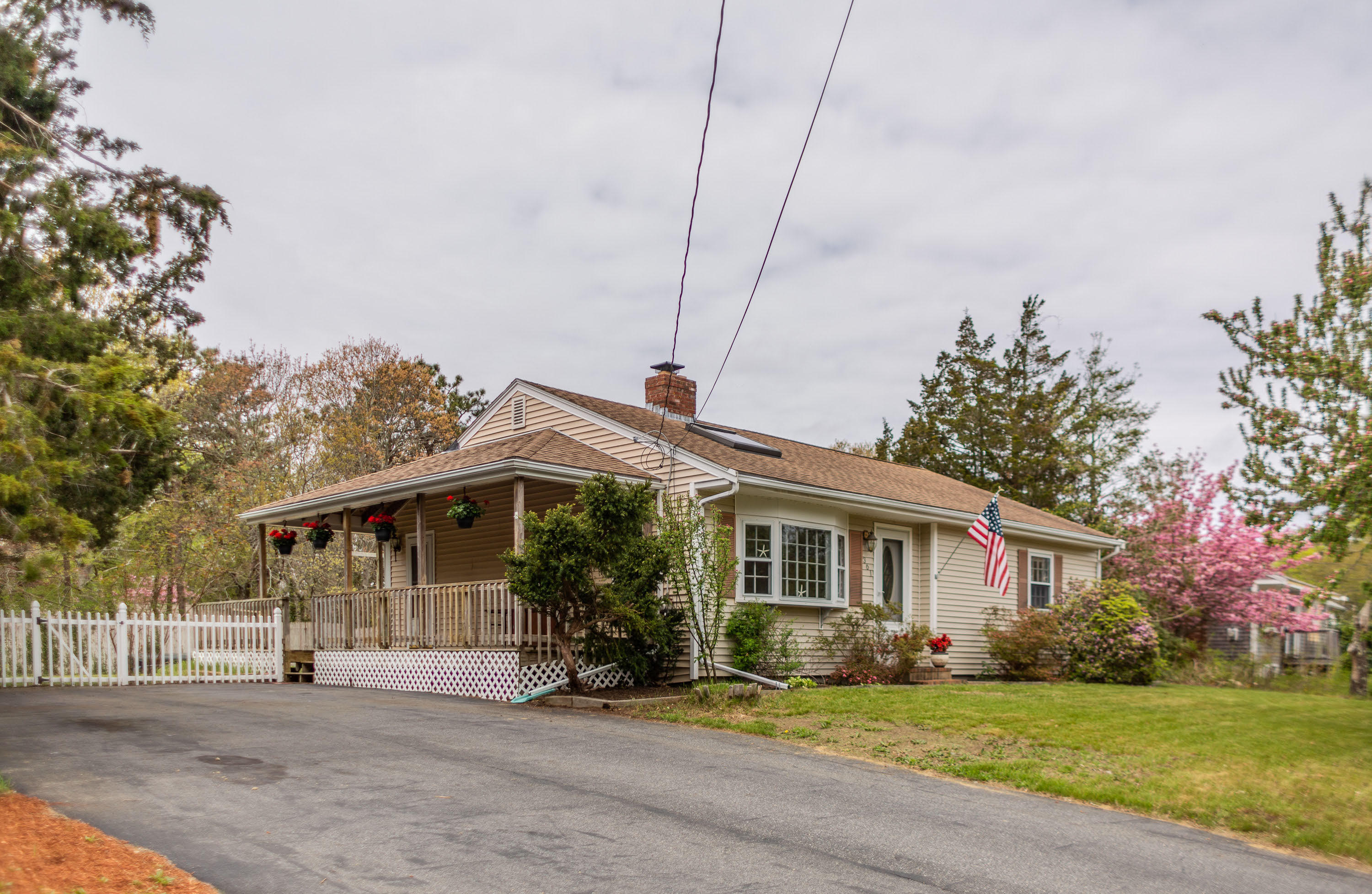 361 Megan Road Hyannis, MA 02601 - Photo 18 of 18 a front view of a house with a garden and tree