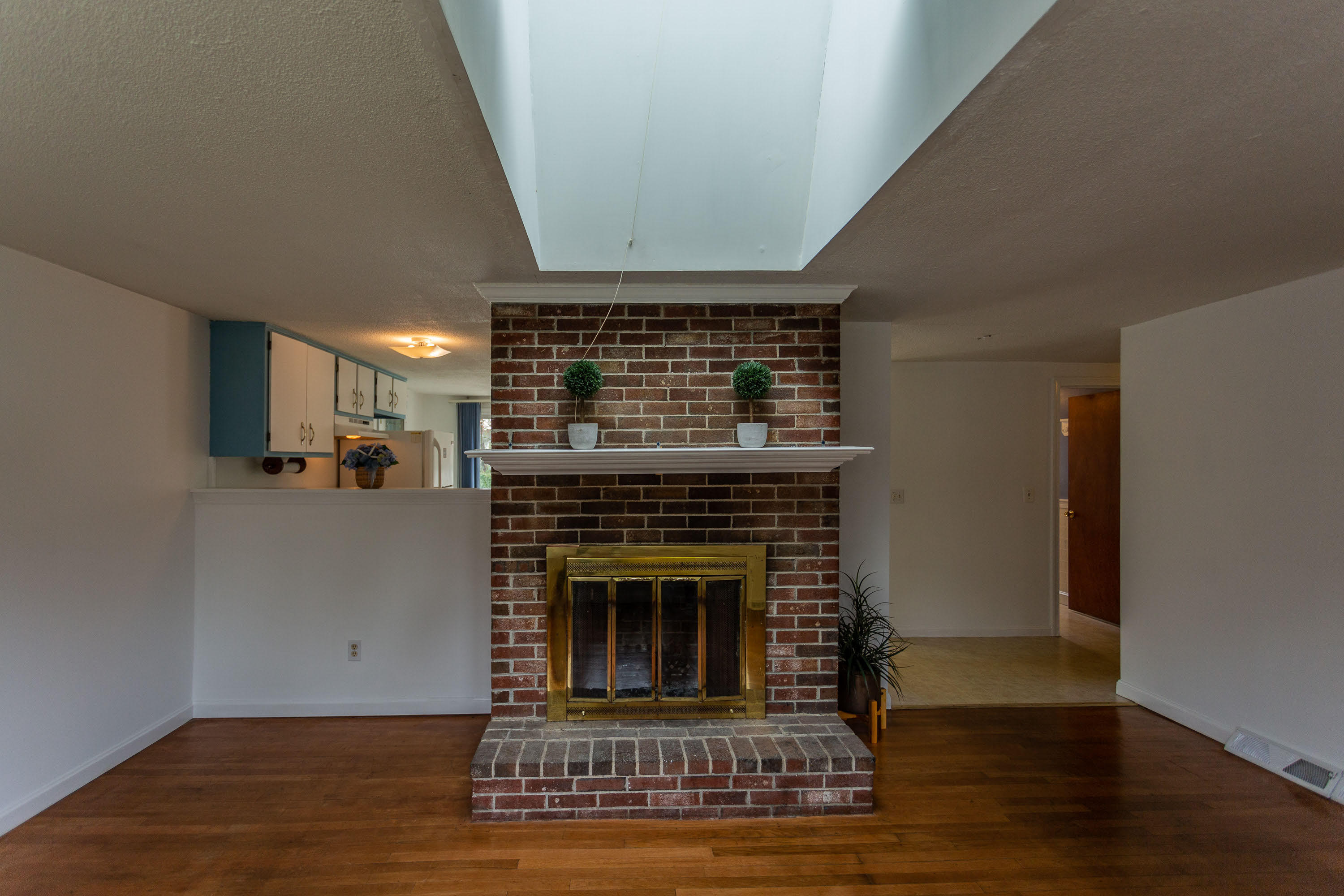 361 Megan Road Hyannis, MA 02601 - Photo 6 of 18 a view of a livingroom with wooden floor and a fireplace