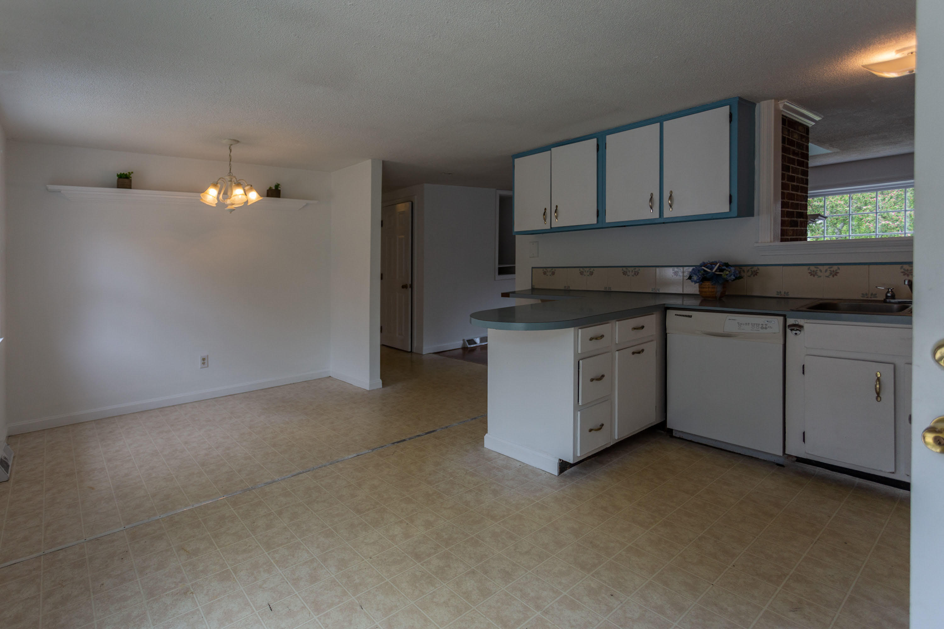 361 Megan Road Hyannis, MA 02601 - Photo 8 of 18 a kitchen with granite countertop a sink a stove and cabinets