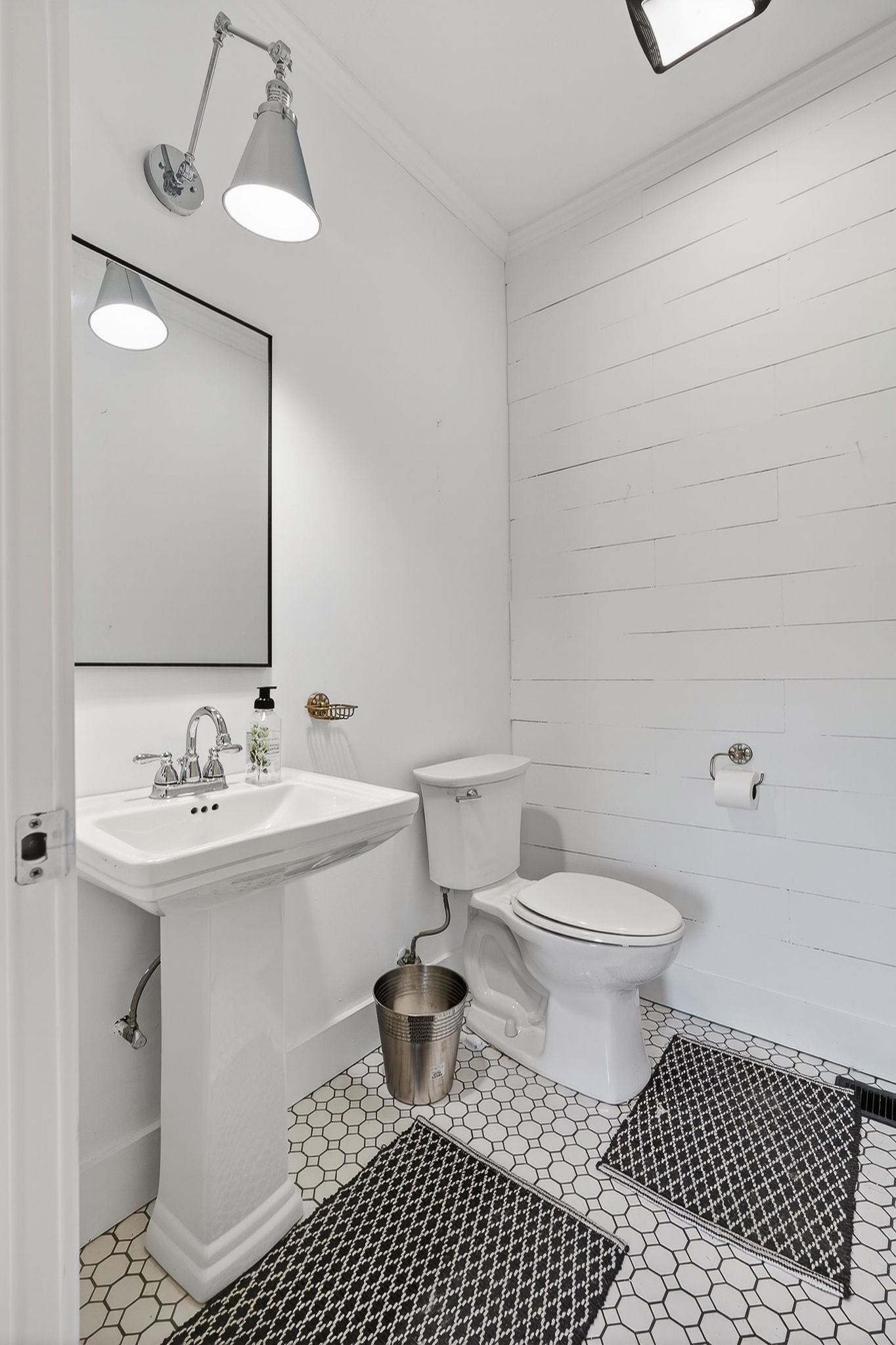 302 Ligon Street Baxter, TN 38544 - Photo 33 of 68 a bathroom with a sink toilet a mirror and shower