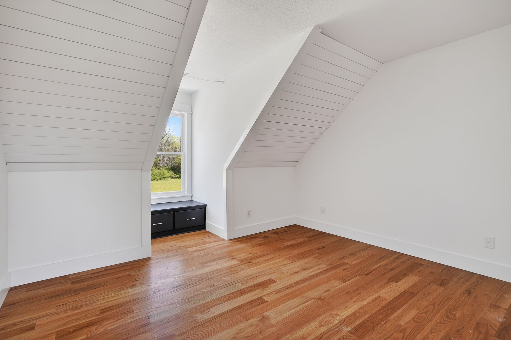 302 Ligon Street Baxter, TN 38544 - Photo 41 of 68 a view of an empty room with wooden floor and a window