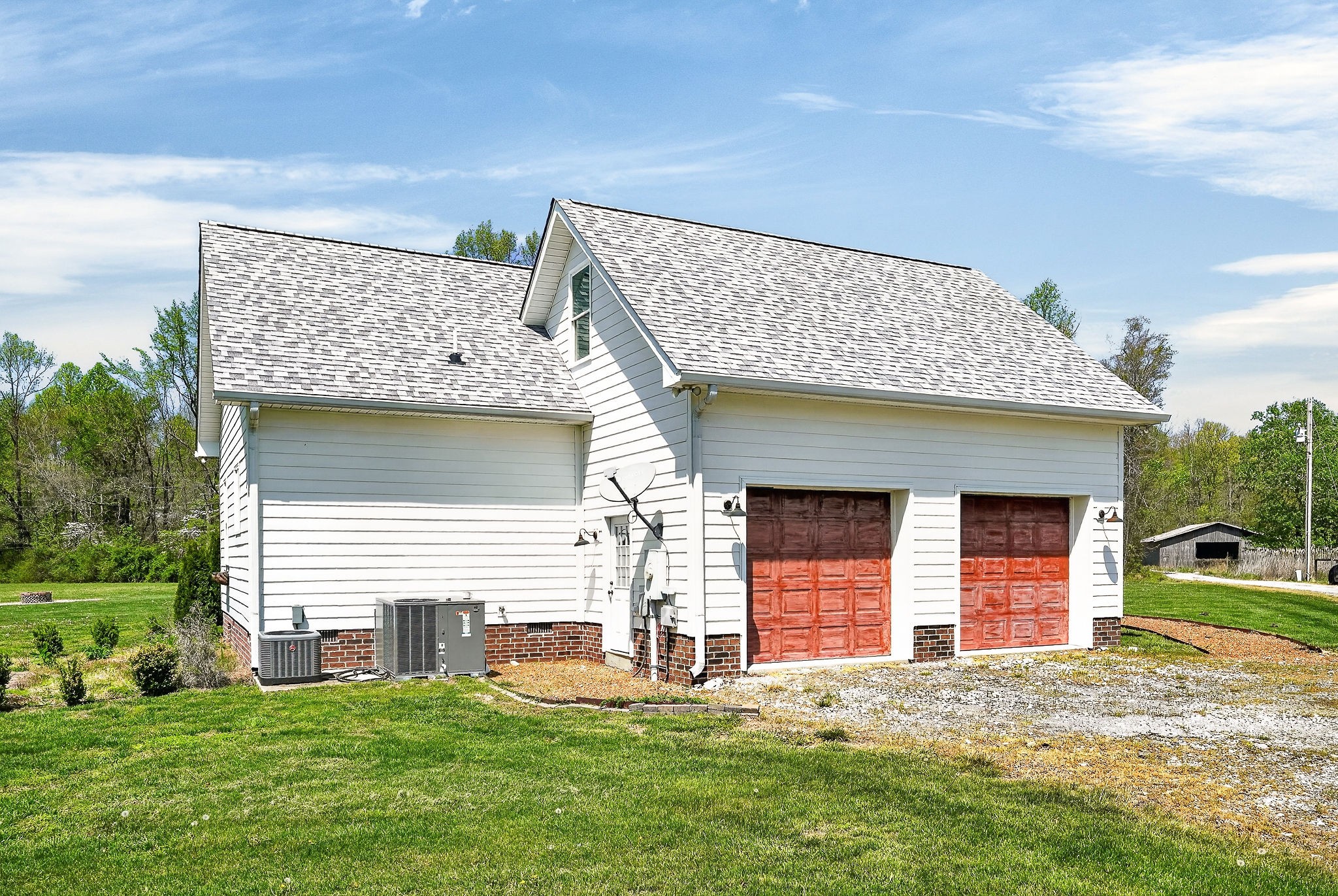 302 Ligon Street Baxter, TN 38544 - Photo 56 of 68 a view of a house with a yard and garage