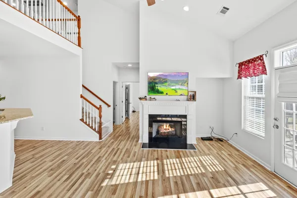 a kitchen with stainless steel appliances granite countertop a sink refrigerator and microwave