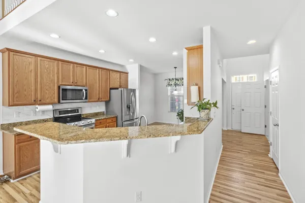 a kitchen with a sink and a refrigerator