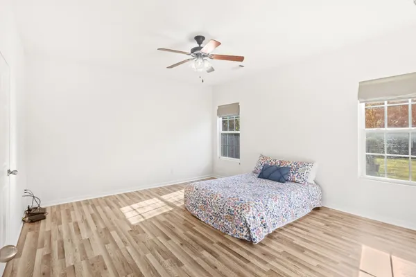 a bedroom with a large bed and a window