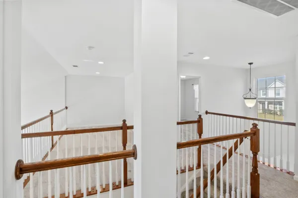 a view of a hallway with staircase