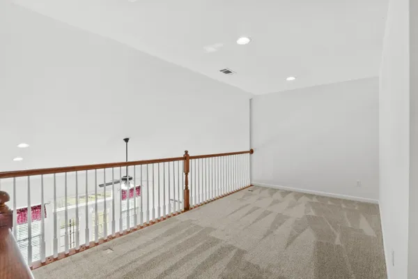 a view of a livingroom with wooden floor