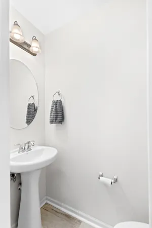 a bathroom with a sink a mirror and vanity