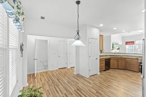 a view of a room with window and wooden floor