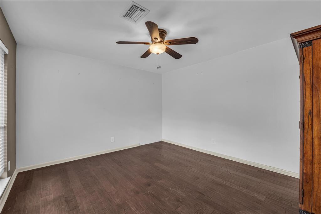 4325 Shady Glen Drive Waco, TX 76708 - Photo 18 of 40 a view of empty room with wooden floor