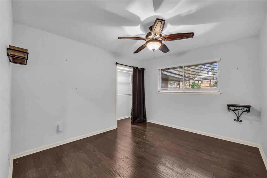 4325 Shady Glen Drive Waco, TX 76708 - Photo 21 of 40 a view of a room with wooden floor and windows