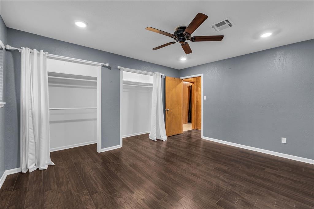 4325 Shady Glen Drive Waco, TX 76708 - Photo 30 of 40 a view of an empty room with wooden floor and a window
