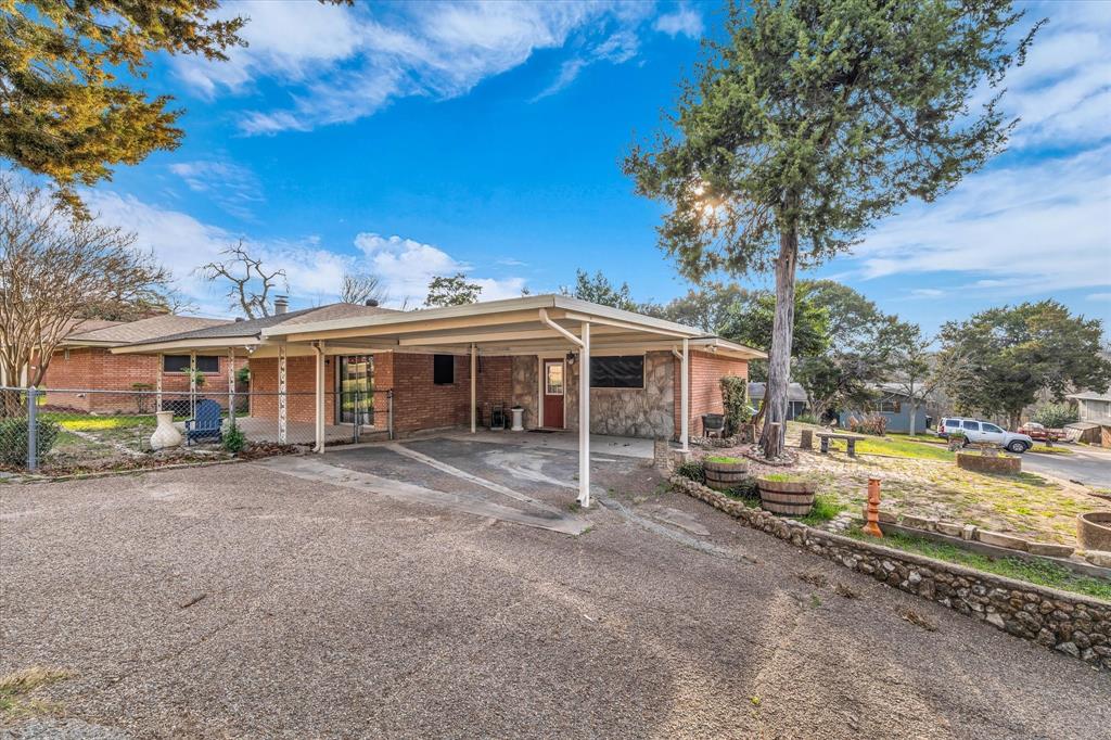 4325 Shady Glen Drive Waco, TX 76708 - Photo 37 of 40 a front view of a house with garden
