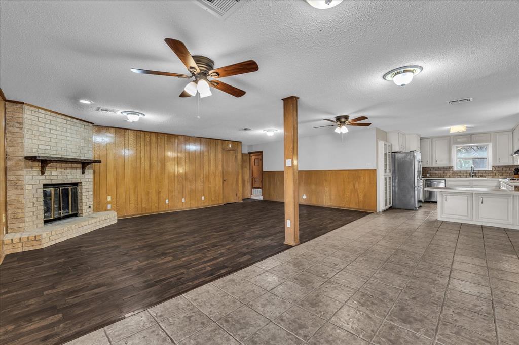4325 Shady Glen Drive Waco, TX 76708 - Photo 5 of 40 a view of a kitchen with a sink and a ceiling fan