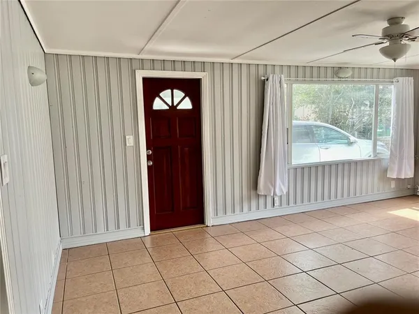 a view of an entryway with wooden floor and door