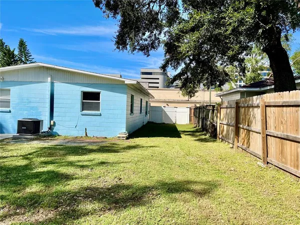 a view of a house with pool and tree s