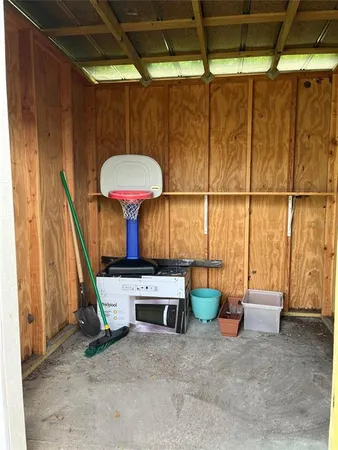 a view of a room with furniture and a window