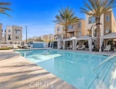 a view of a swimming pool with a yard