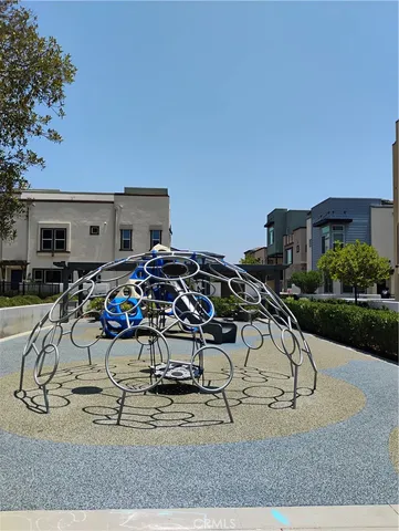 a view of a house with a porch and garden