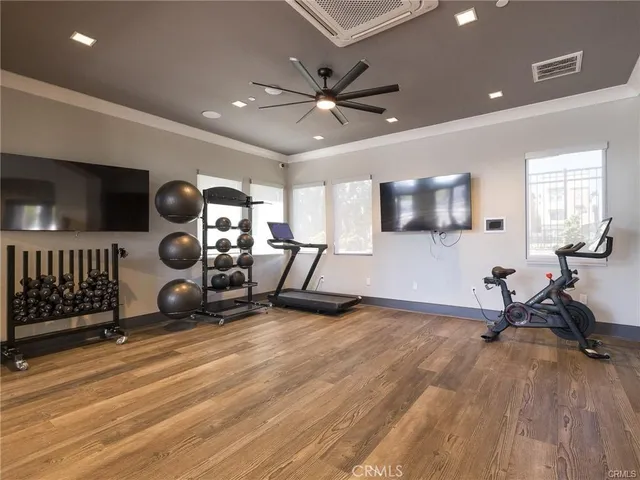 a living room with lots of furniture and a chandelier