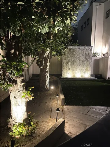 a view of backyard with seating space